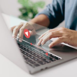 Man hands using laptop for streaming online, watching video on internet, show or tutorial, live concert